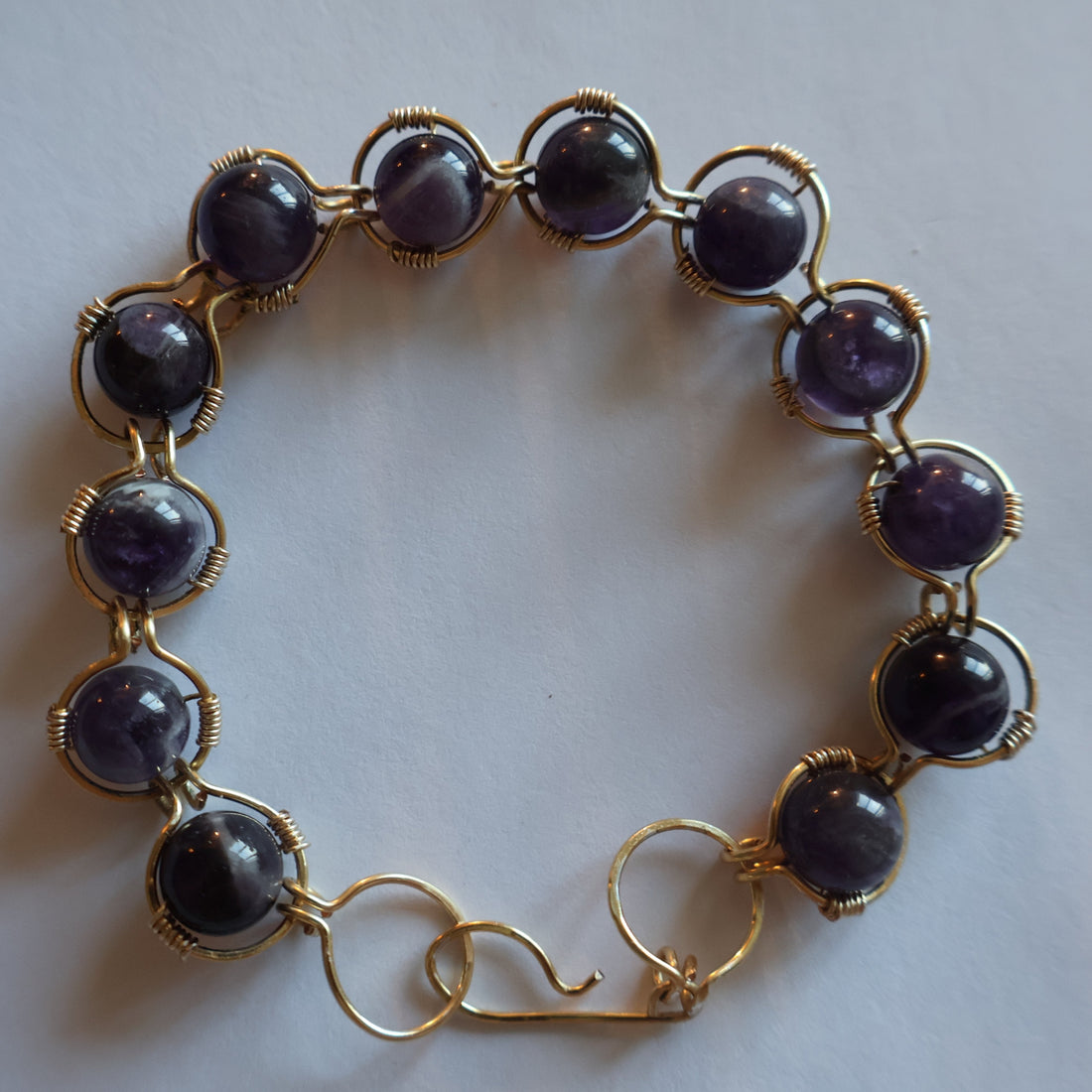 Handcrafted Amethyst Bracelet with genuine amethyst gemstones and gold plated wire, showcasing rich violet hues.