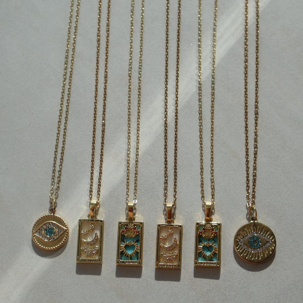Taro Card Necklace with Cubic Zirconia embellishments in Moon and Empress designs, vintage-inspired, gold-plated.