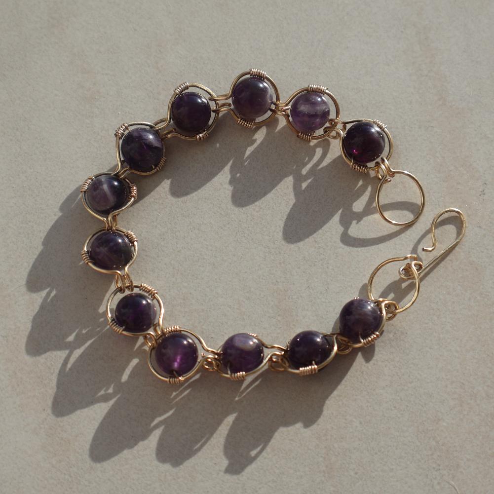 Handcrafted Amethyst Bracelet with genuine amethyst gemstones and gold plated wire, showcasing rich violet hues.