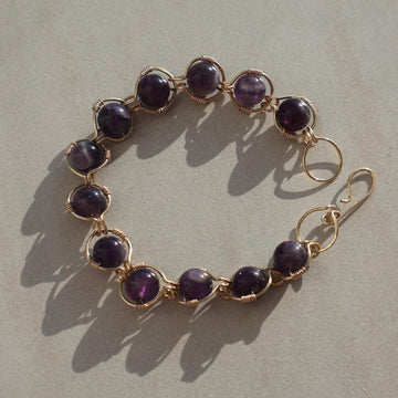 Handcrafted Amethyst Bracelet with genuine amethyst gemstones and gold plated wire, showcasing rich violet hues.