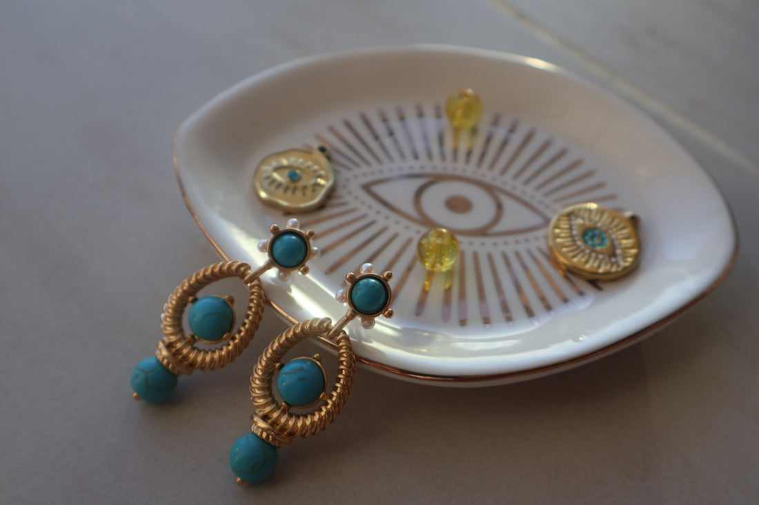 Turquoise vintage style earrings with natural turquoise beads and gold-plated design.