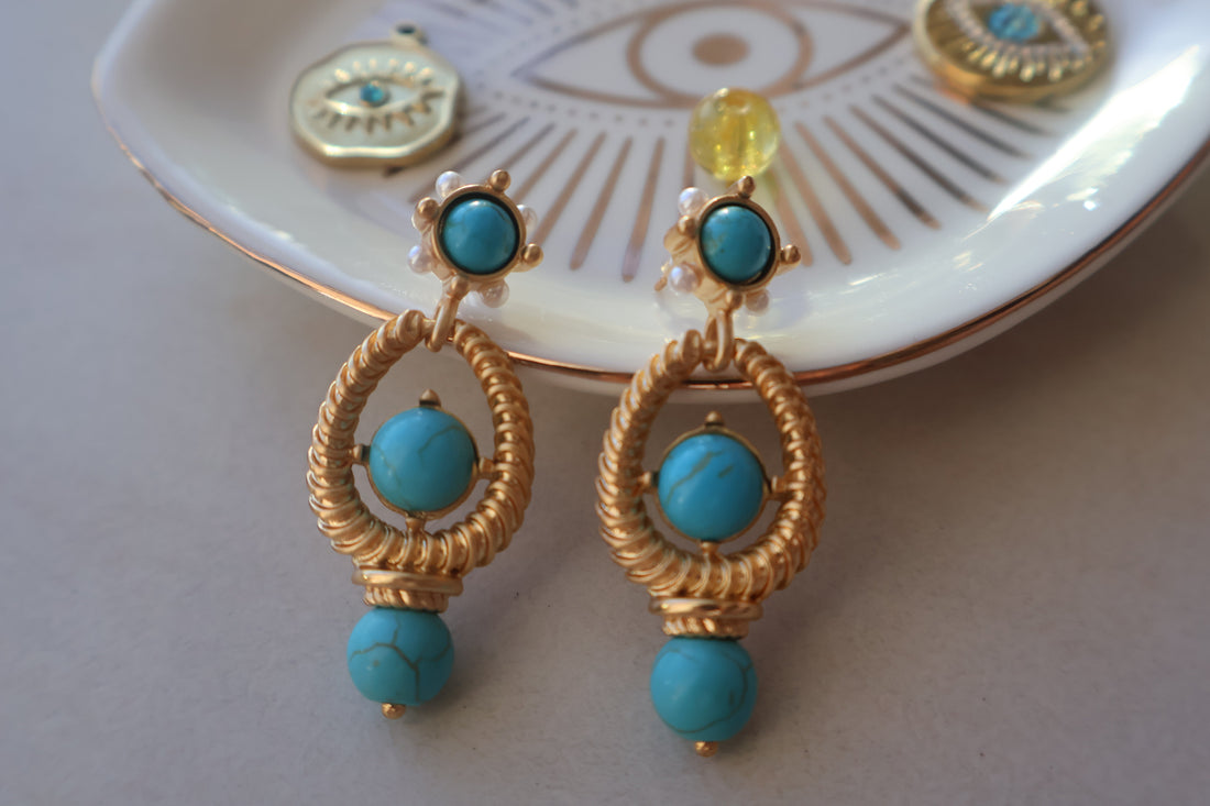 Turquoise vintage style earrings with natural turquoise beads and gold-plated design.