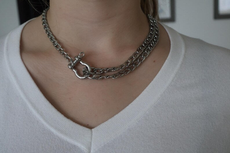 Silver Cuban link necklace on display bust.
